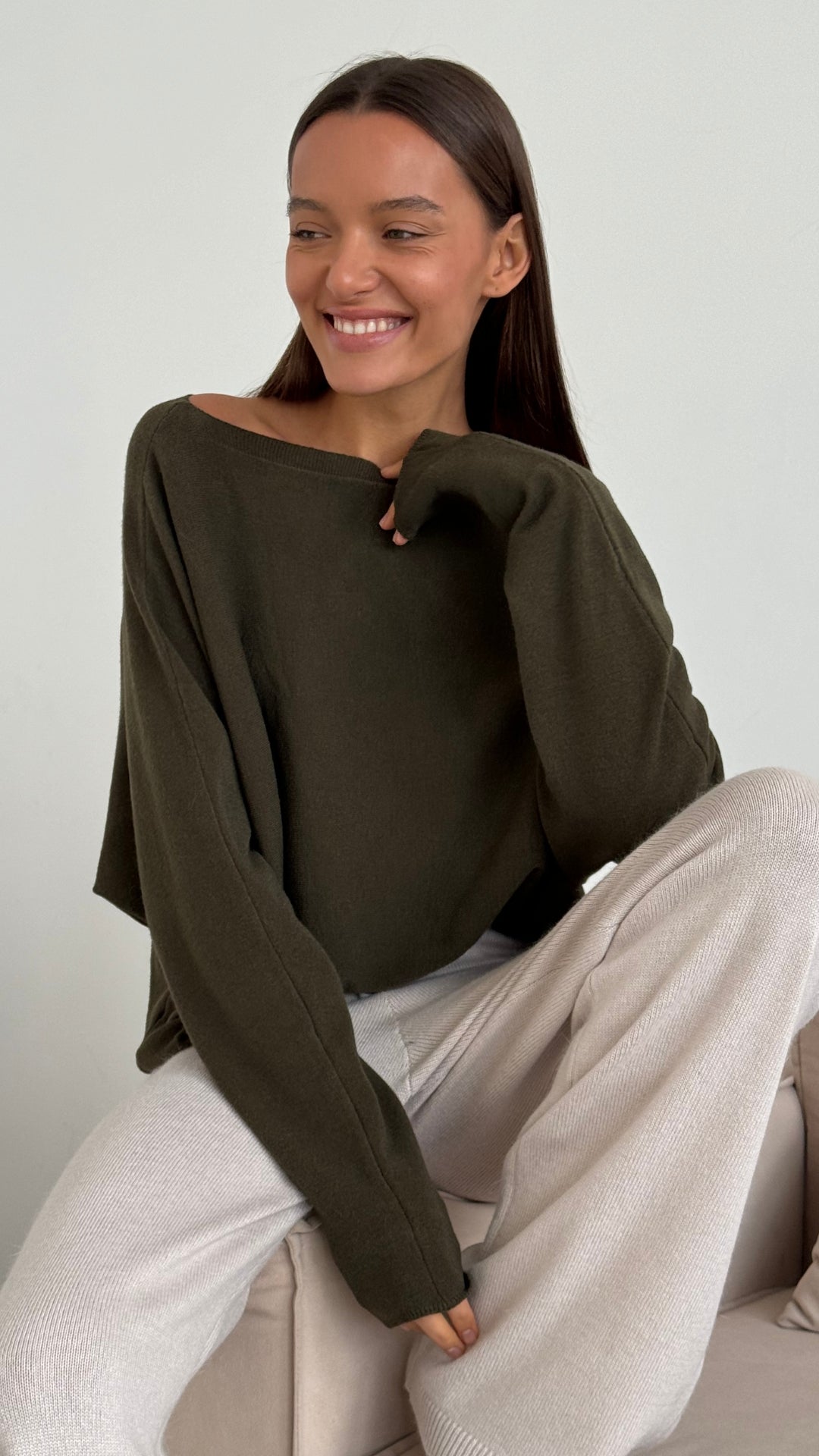 Charli Poppy sweater in khaki sitting