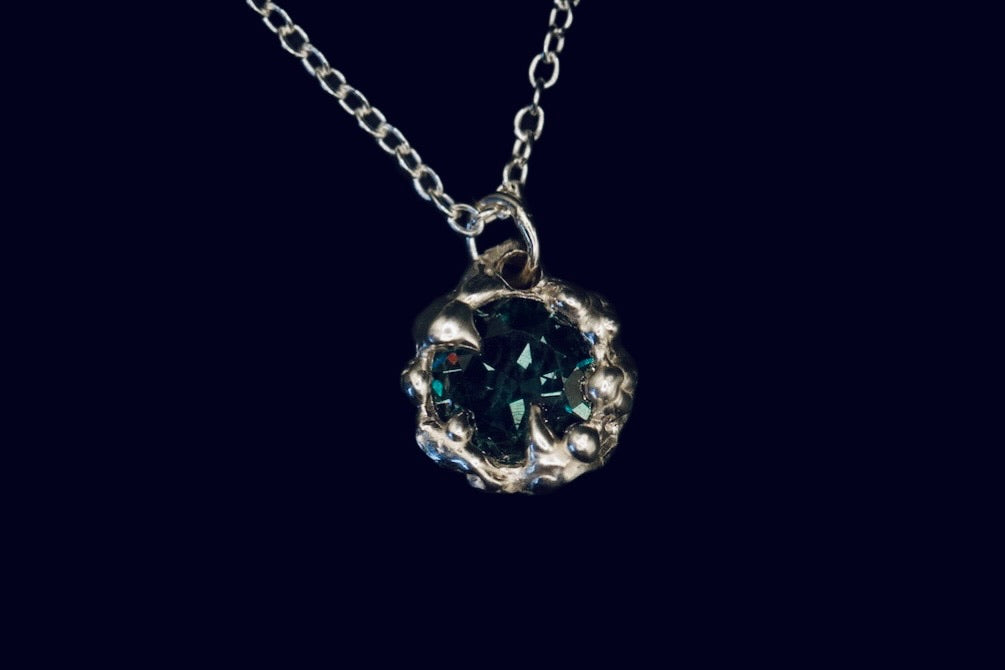 Karlek sterling silver necklace with green tourmaline gemstone close up