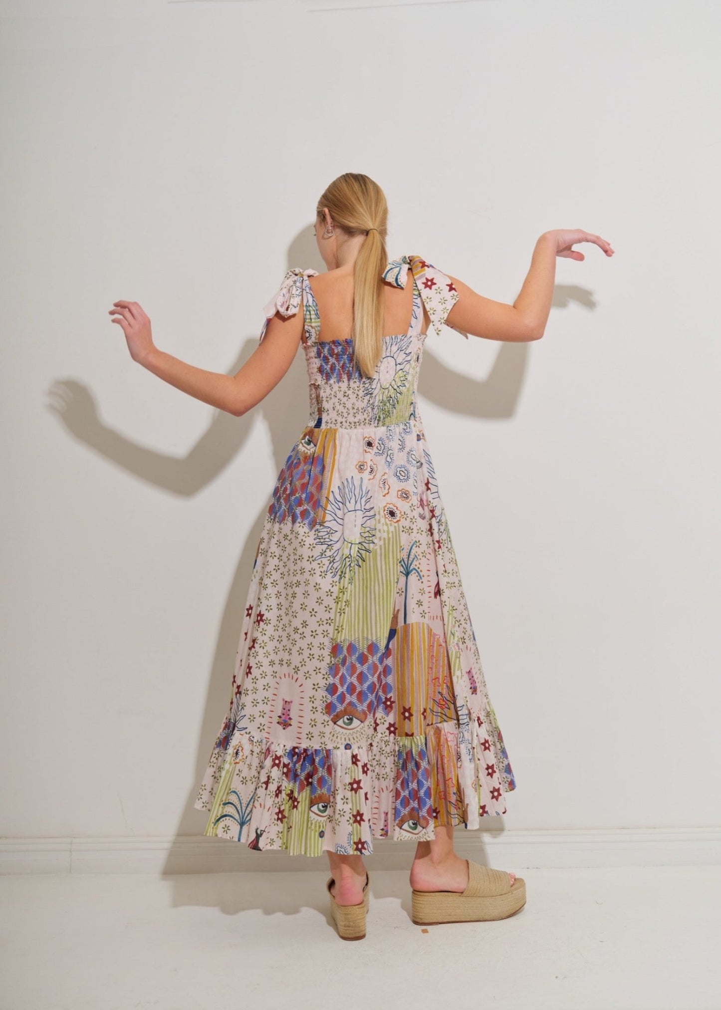 Asha 11 Ganda dress in Surya back arms up