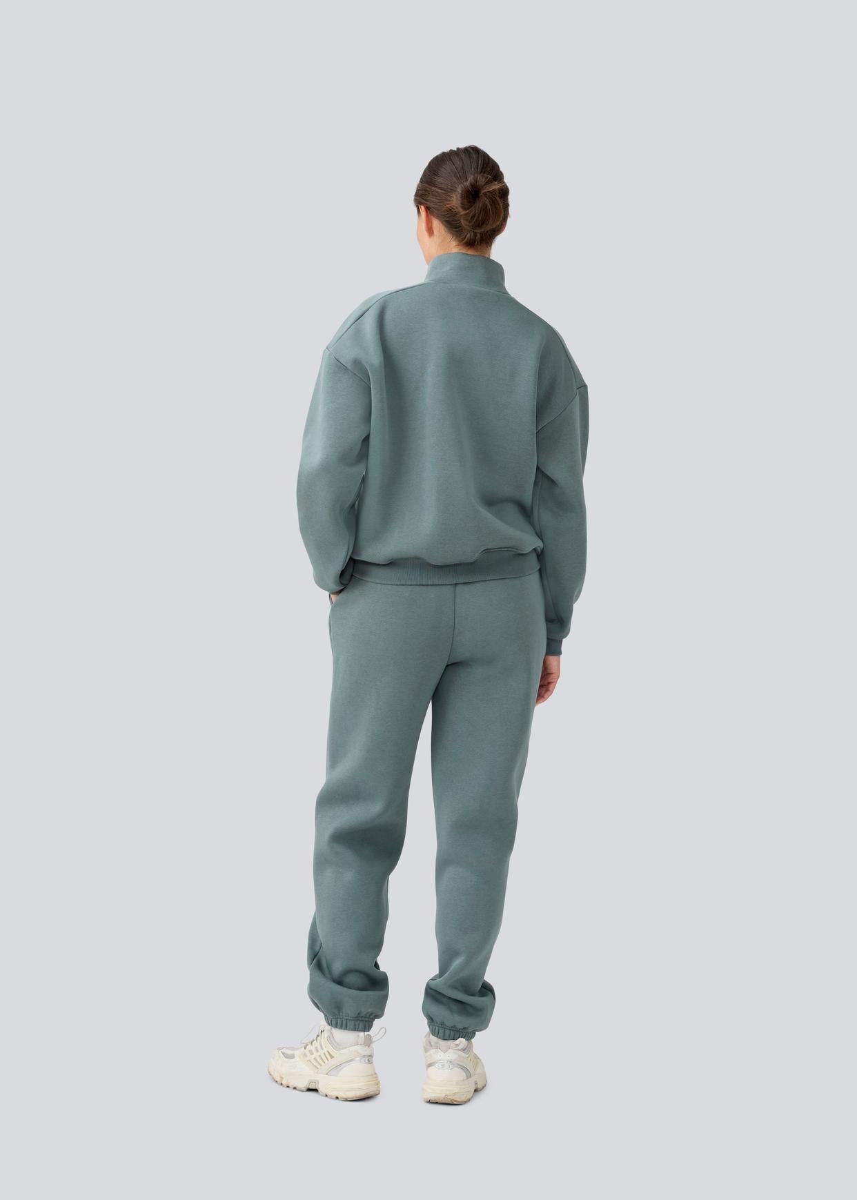 Modstrom Tia MD T Neck Sweater – Balsam Green on model back shot