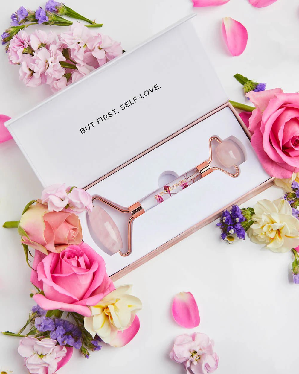 Bopo floral rose quartz face roller in open box