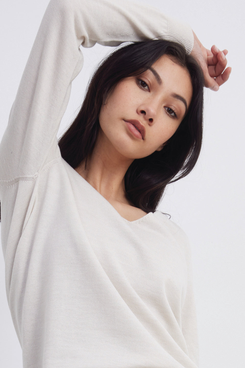 Standard Issue merino v-neck slouchy sweater in alabaster white close up