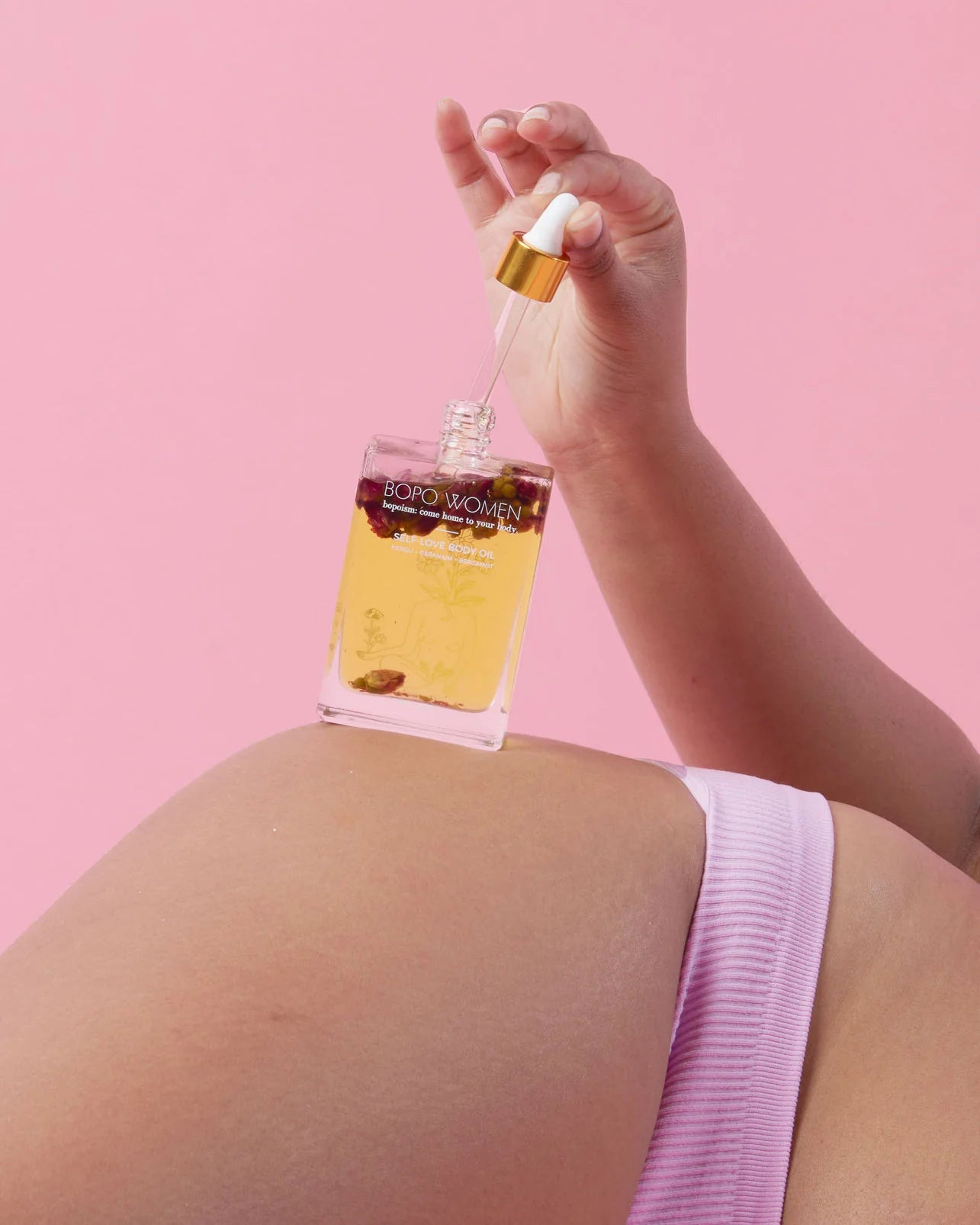 Bopo self love body oil with model image 2