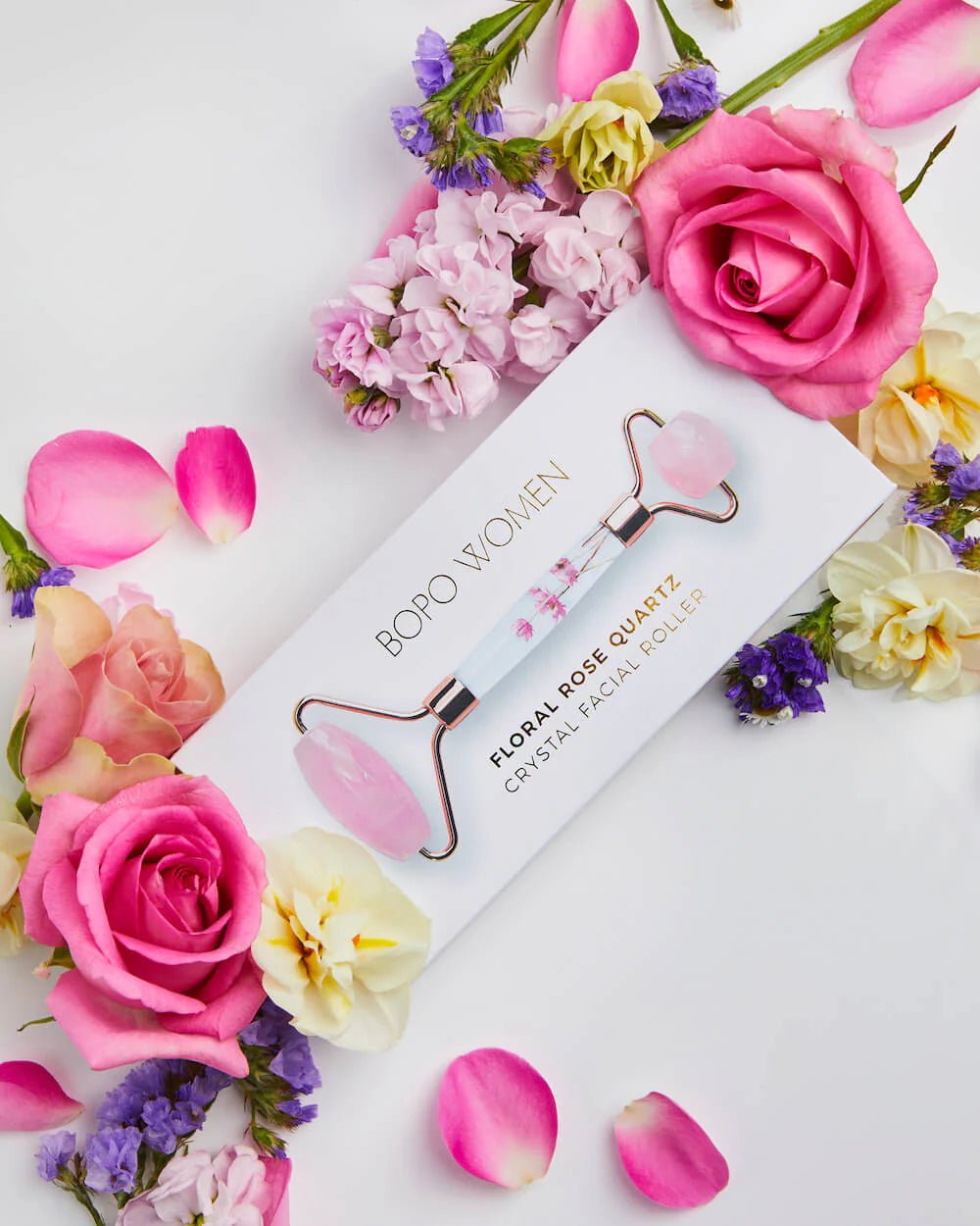 Bopo floral rose quartz face roller in box