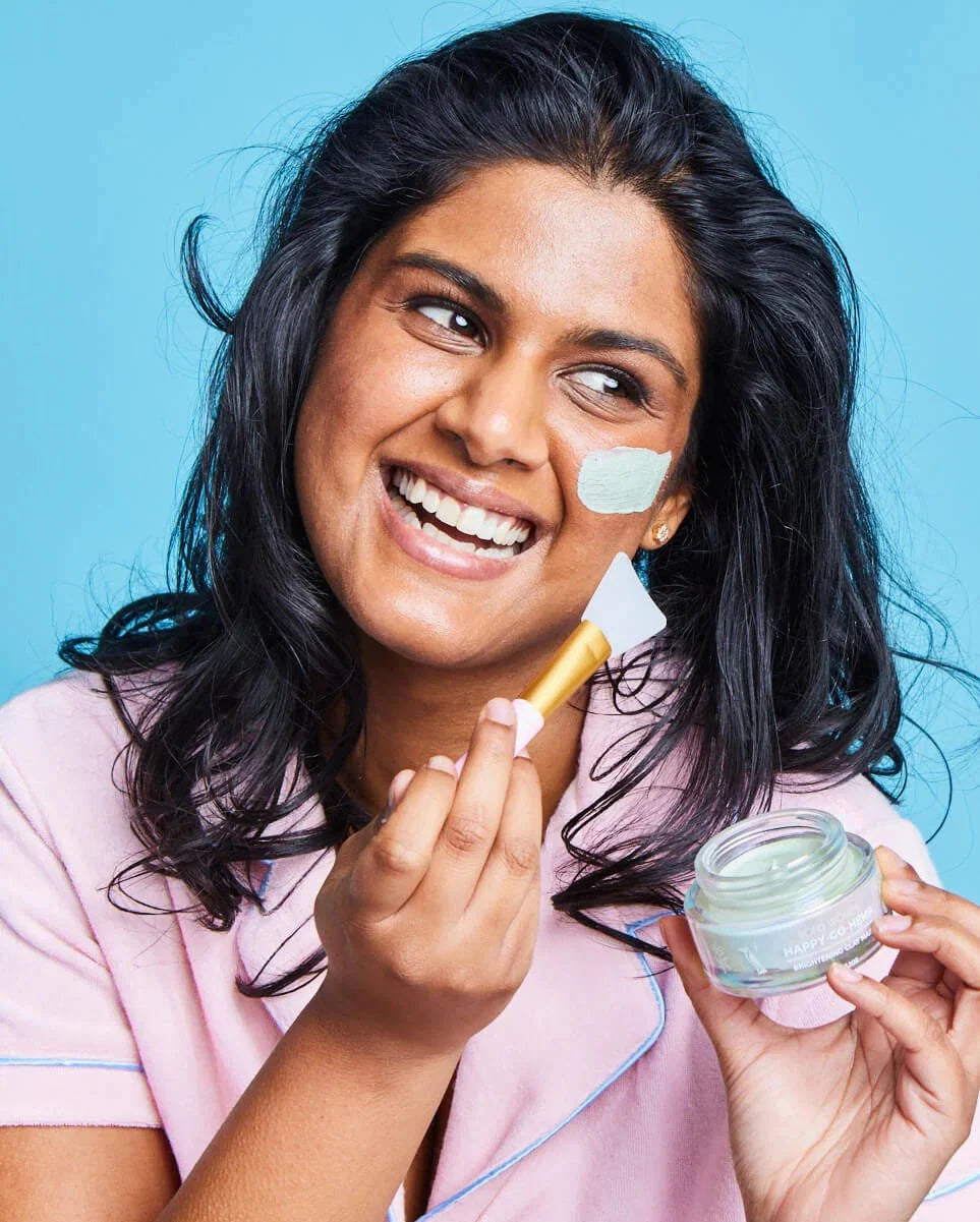 Bopo Women Happy go hemp clay mask model applying the mask 