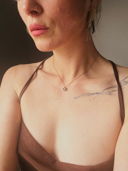 Sacral necklace 9ct yellow gold with green tourmaline on model