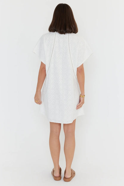 Alexandra Isaac dress in white back shot