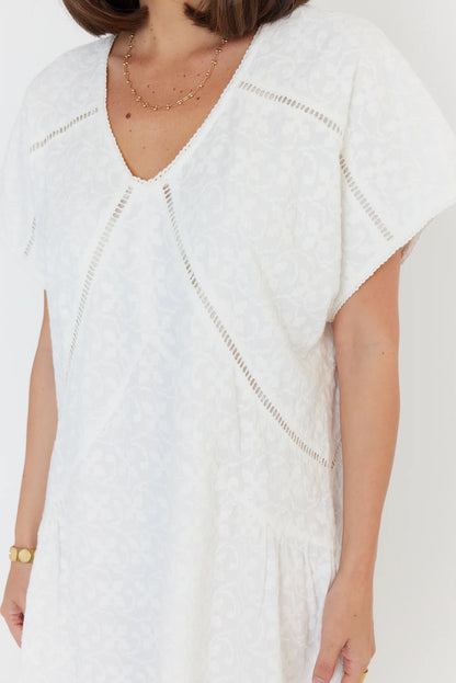 Alexandra Isaac dress in white close up