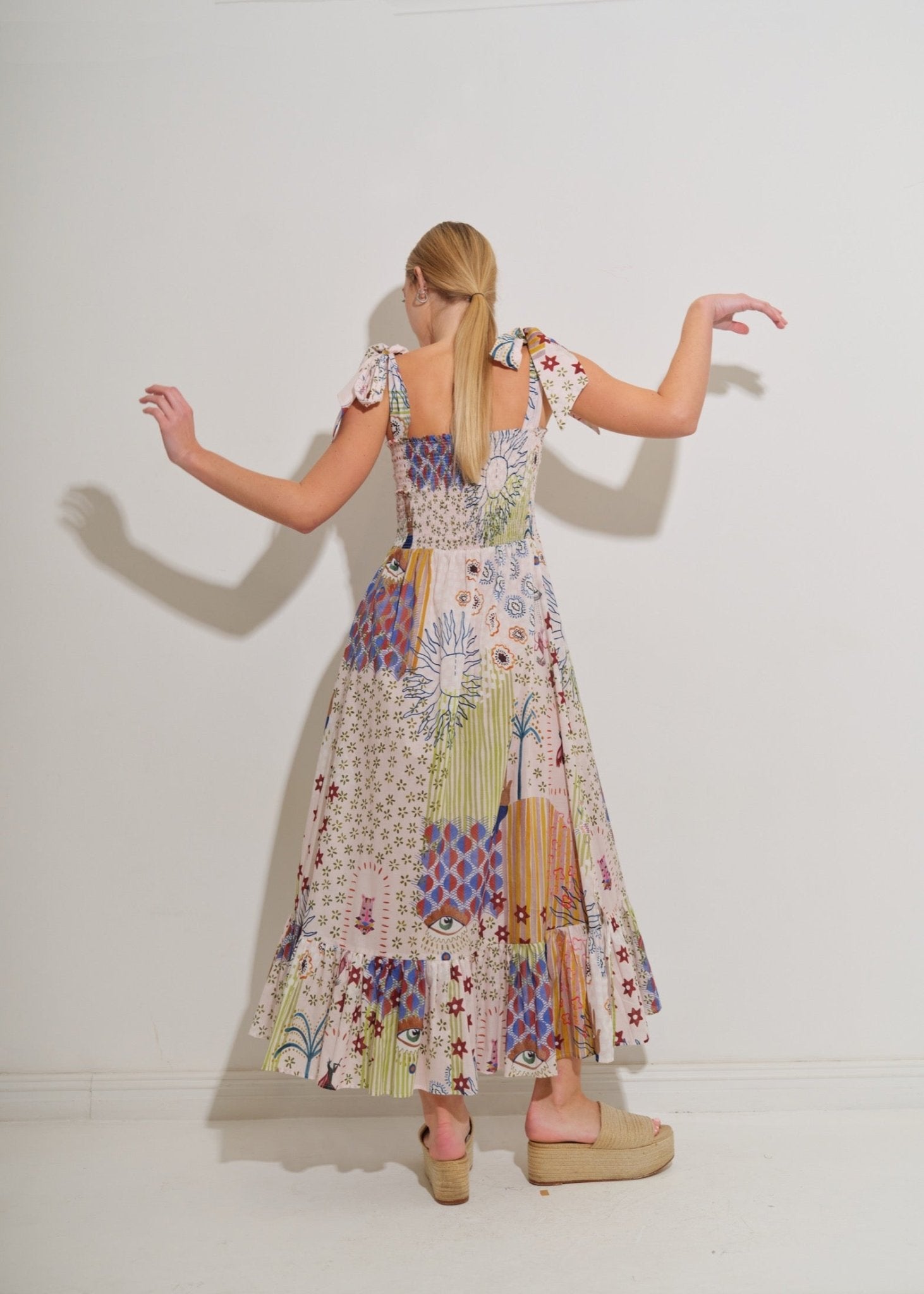 Asha 11 Ganda dress in Surya back arms up