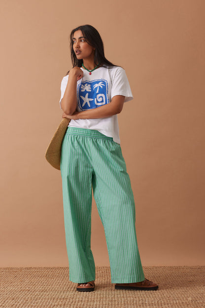 Ceres Life The Lounge Pant – Zesty Green Triple Stripe on model 1