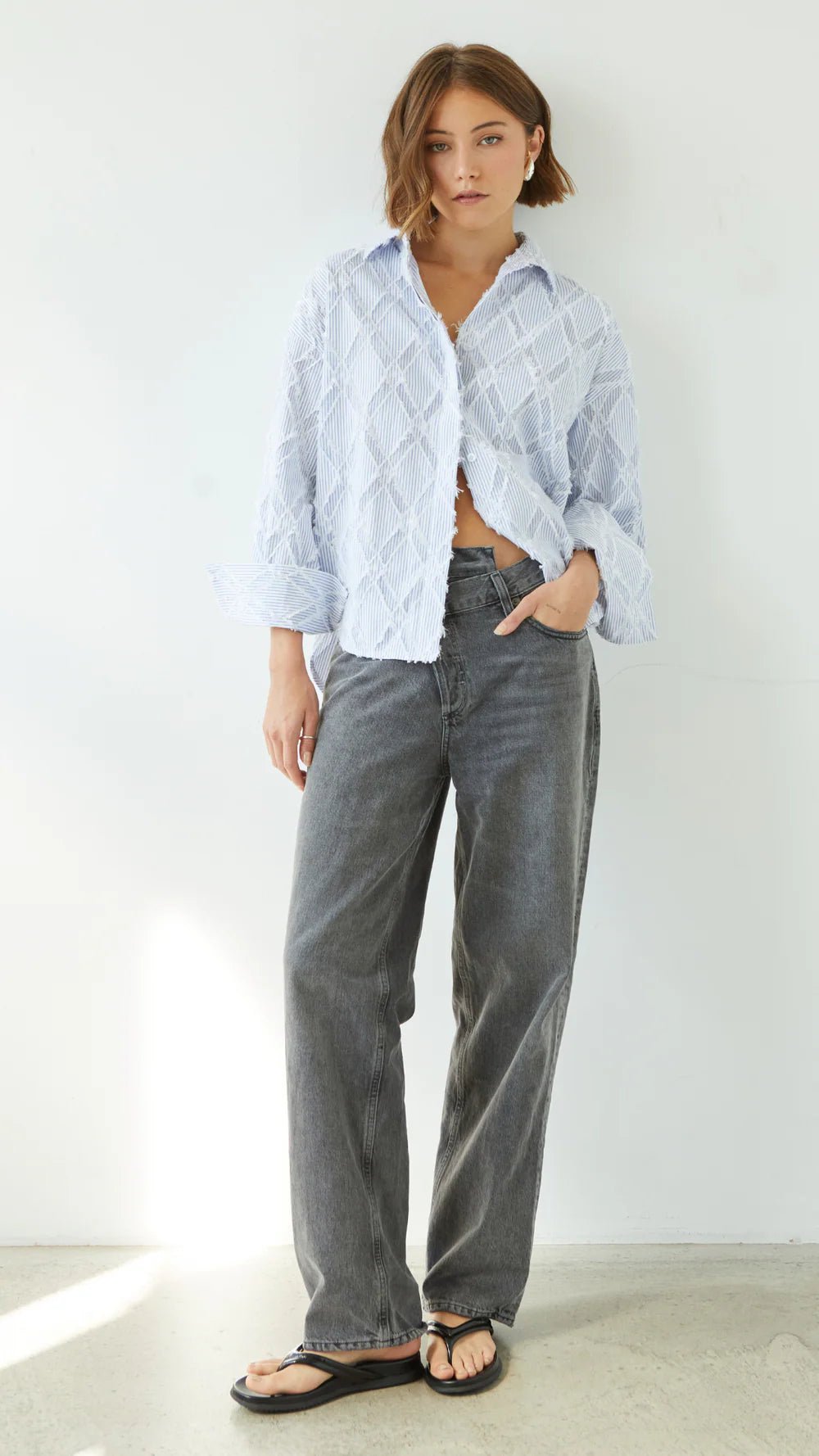 Charli Marlowe Shirt in blue stripe on model with grey jeans