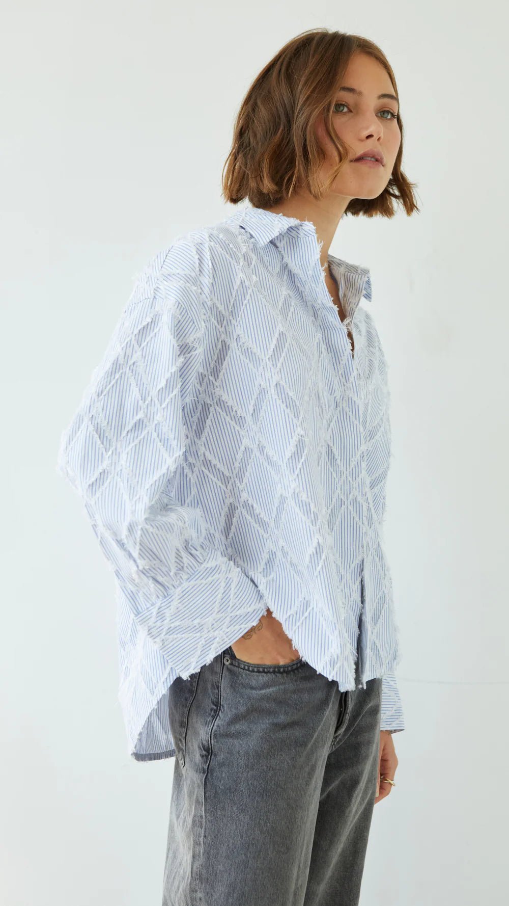 Charli Marlowe Shirt in blue stripe side on hand in pocket