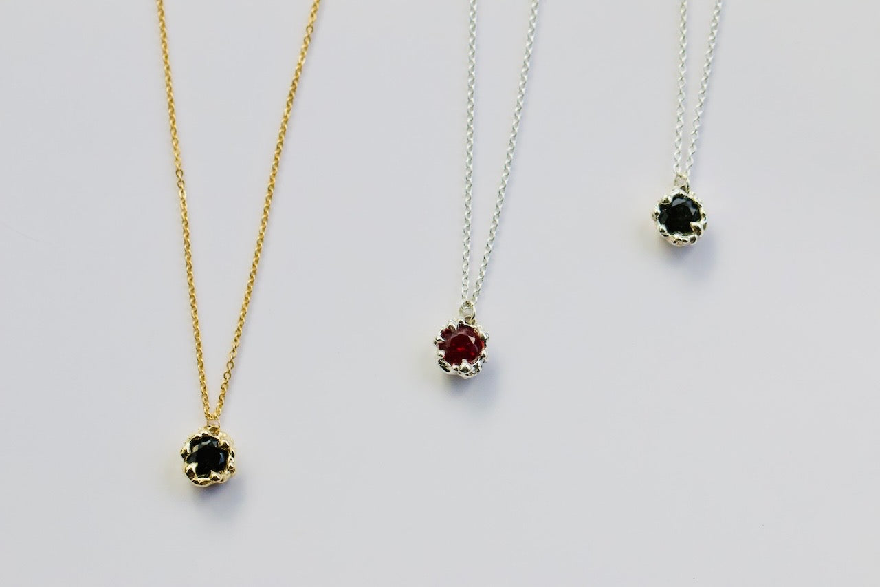 Karlek sacral necklaces lined up 