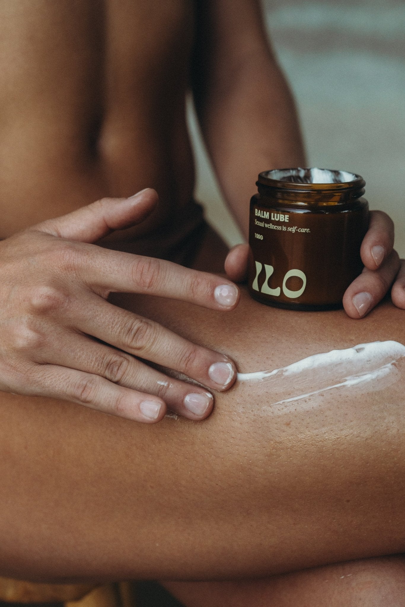 Ilo Wellness balm lube applied by model