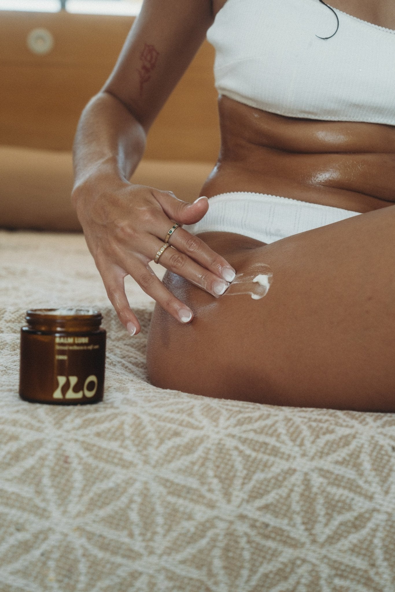 Ilo Wellness balm lube applied by model