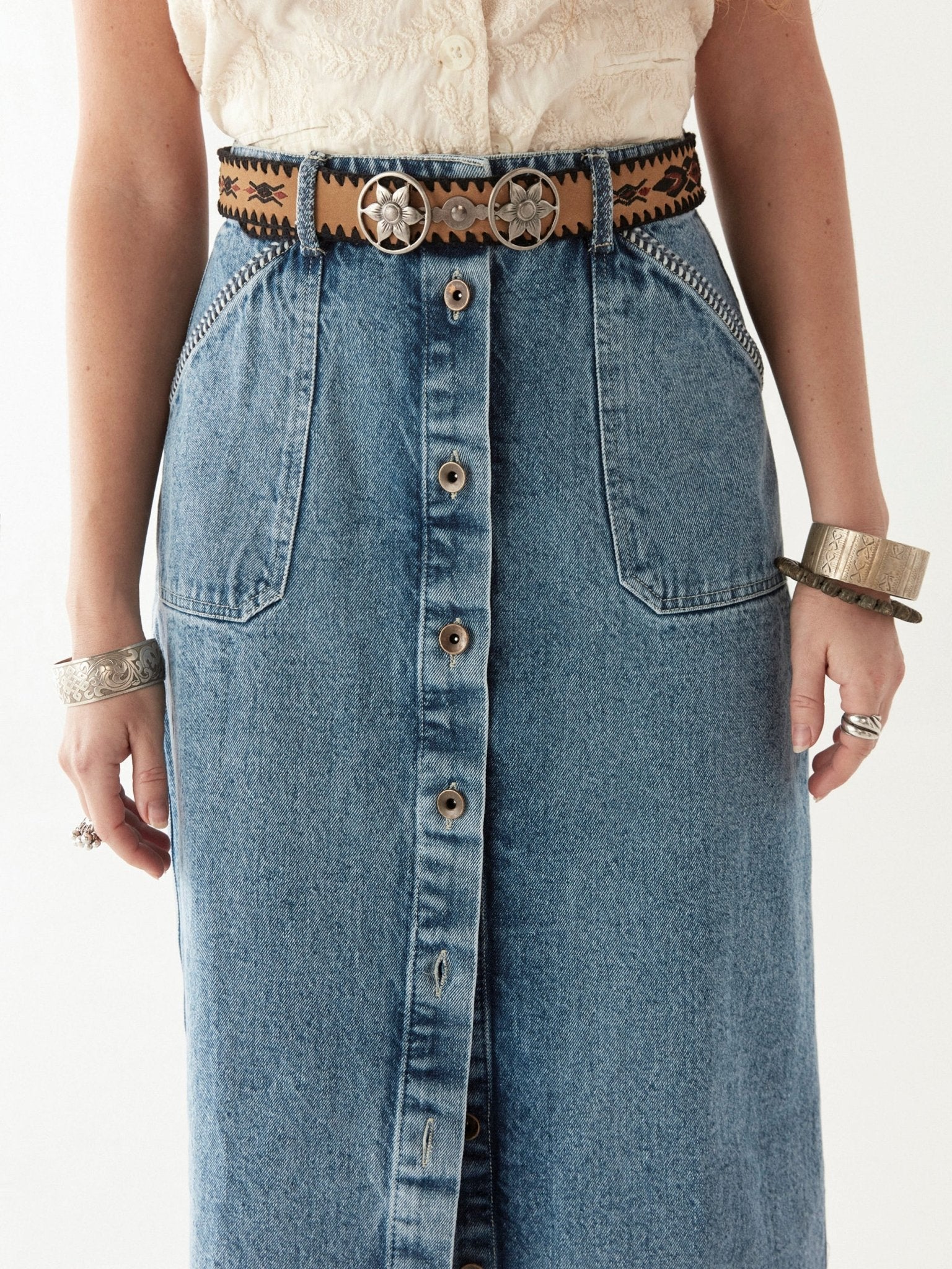 Maison Hotel Agustina Belt in Yerba Mata on model with denim skirt 