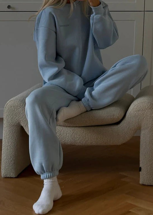 Modstrom Tia MD Sweatshirt – Cashmere Blue on model sitting down 