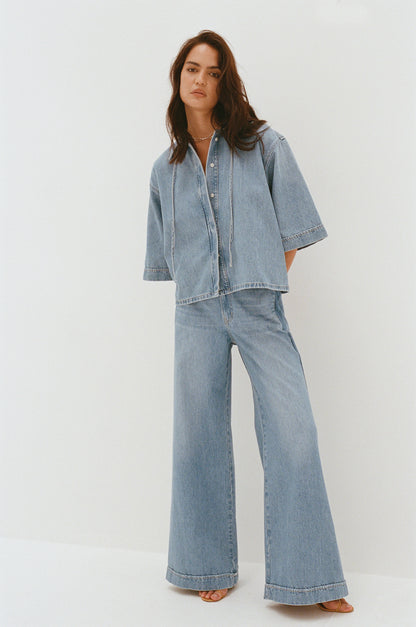 Outland Denim Lotus Pants in bluejay campaign shot in film 1