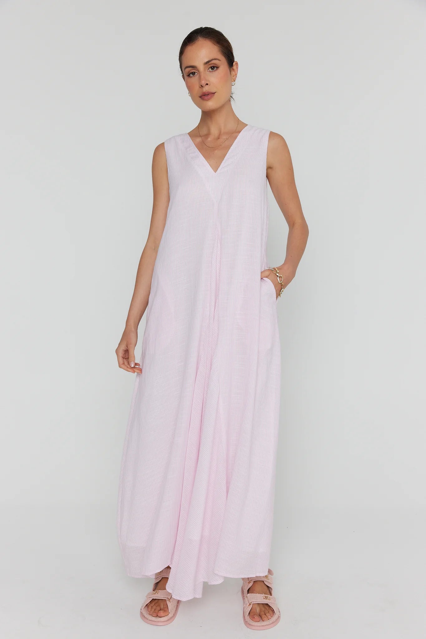 Alexandra Simi cotton dress in pink hand in pocket
