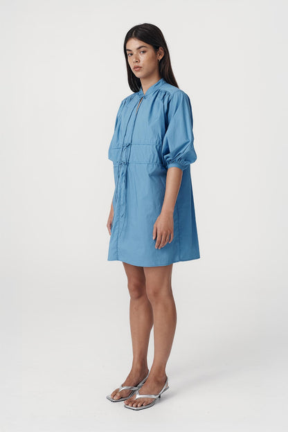 Rowie the label Piper mini dress in cerulean blue studio shot side on