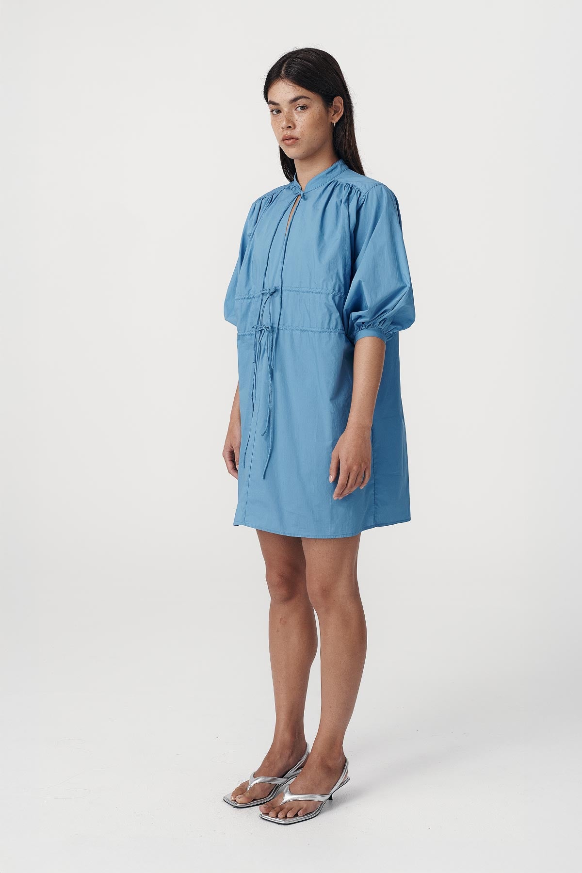 Rowie the label Piper mini dress in cerulean blue studio shot side on 2