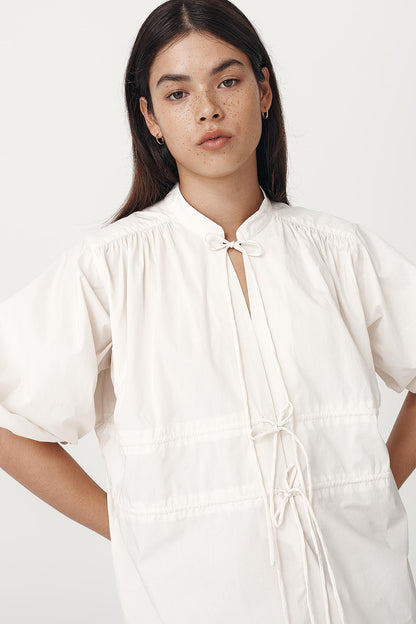 Rowie the label piper organic mini dress in creme studio shot 3