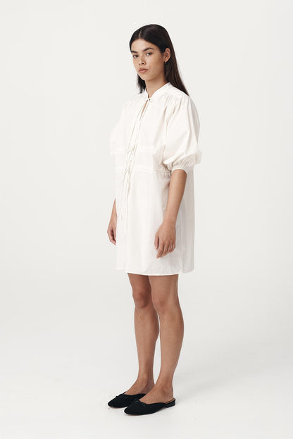 Rowie the label piper organic mini dress in creme studio shot side on