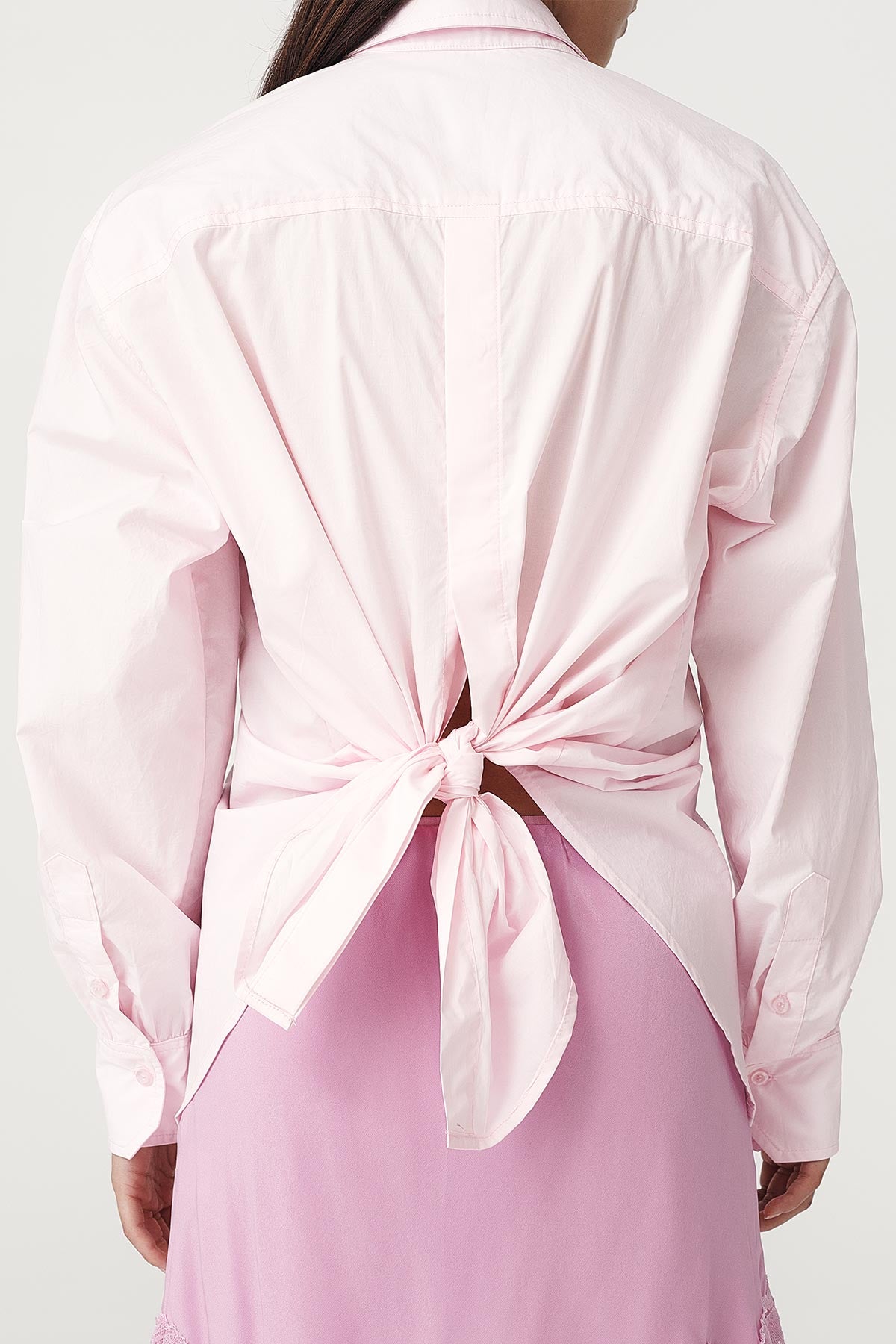 Rowie the label Ramona tie back shirt in powder pink studio back shot close up 