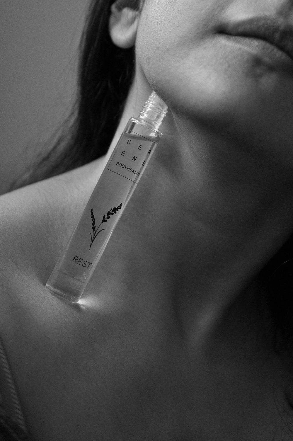 Serene rest roll-on perfume oil black & white model shot