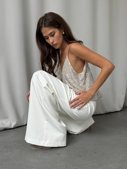 Charli Sienna cami in silver – model sitting down 