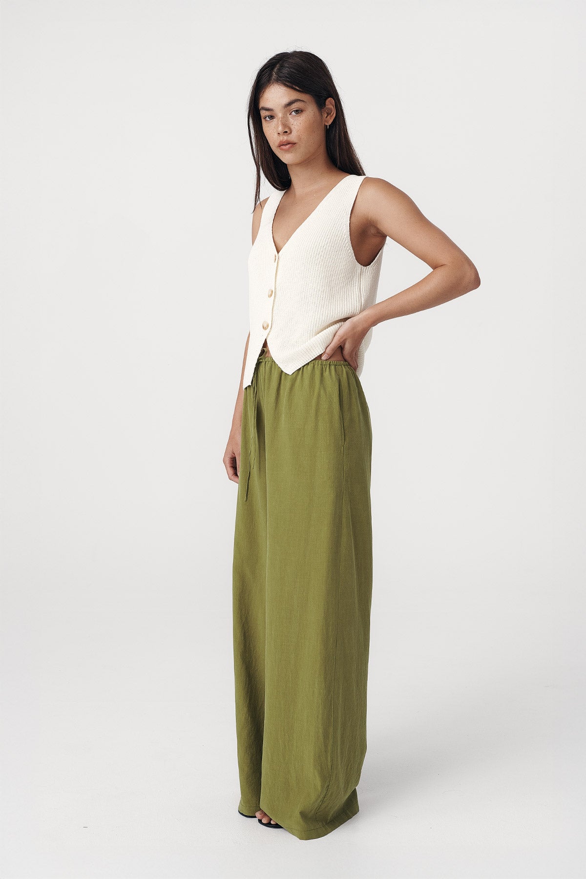 Rowie the label Tia palazzo pants in palm green studio shot side on 3