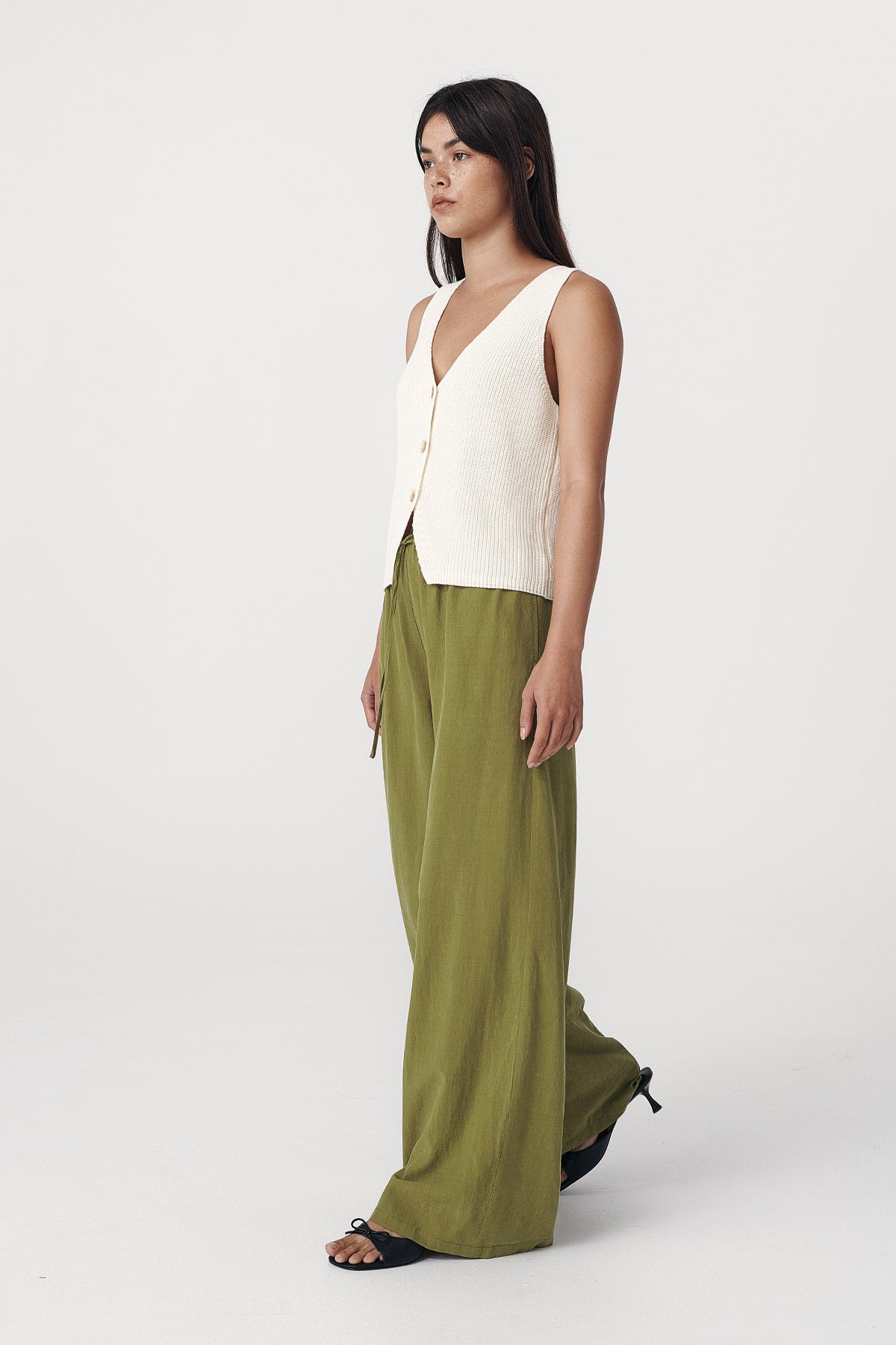 Rowie the label Tia palazzo pants in palm green studio shot side on 4